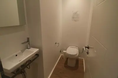 a white bathroom with a toilet and a sink at Luxury, central 3 bedroom, 3 bathrooms 5 mins from the Palais 410 in Cannes