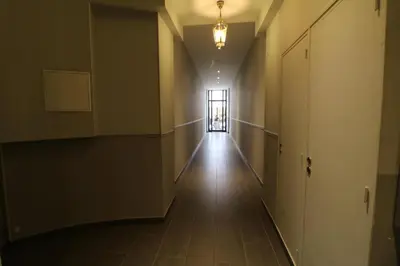 an empty hallway with a door and a window at Luxury, central 3 bedroom, 3 bathrooms 5 mins from the Palais 410 in Cannes