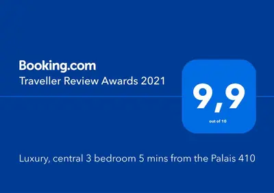 a blue box with the words travel review awards at Luxury, central 3 bedroom, 3 bathrooms 5 mins from the Palais 410 in Cannes