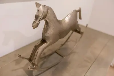 a metal horse statue sitting on a table at Résidence Bouttau by Connexion in Cannes