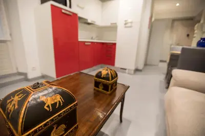 a living room with a table and a helmet on it at Résidence Bouttau by Connexion in Cannes