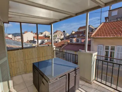 a balcony with a view of a city at Studios Alea in Cannes