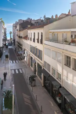 an empty street in a city with buildings at 110 m2 golden square, renovated, 20metres croisette, parking private in Cannes