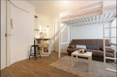 a living room with a couch and a bunk bed at Colorful Studio Cannes in Cannes