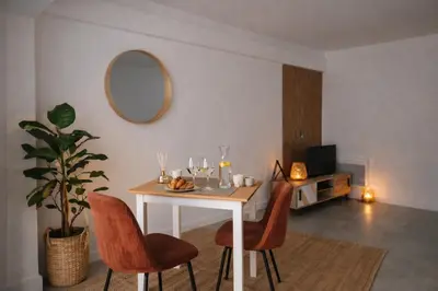 a white bathroom with a shower and a toilet at Apartment Cannes Croisette in Cannes