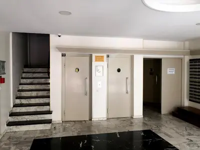 a white bathroom with a shower and a toilet at Apartment Cannes Croisette in Cannes
