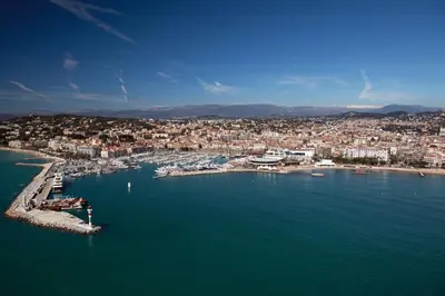 an aerial view of a harbor with a city at Hotel America in Cannes