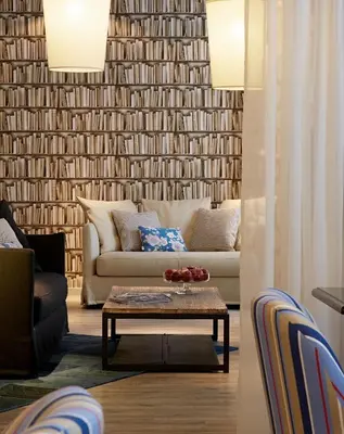 a living room with a couch and a coffee table at Hotel America in Cannes