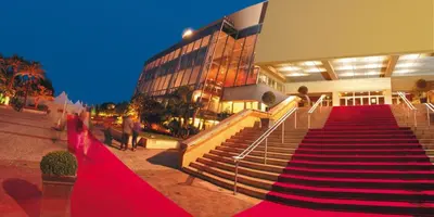 a building with stairs in front of a building at Hotel America in Cannes