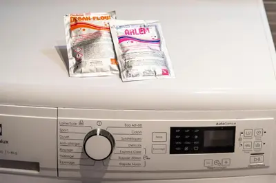 a washing machine with magazines on top of it at Lovely Renovated 45m2 in the hearth of Cannes in Cannes