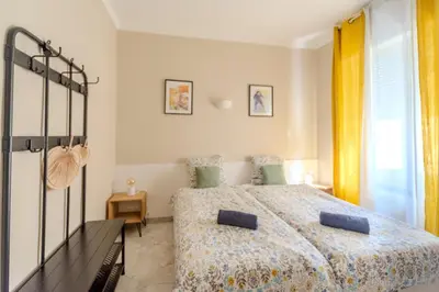 a bedroom with a bed and a window at Lovely Renovated 45m2 in the hearth of Cannes in Cannes