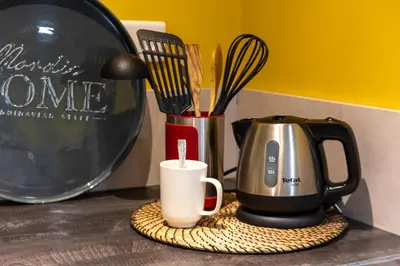 a kitchen counter with a coffee pot and utensils at Lovely Renovated 45m2 in the hearth of Cannes in Cannes