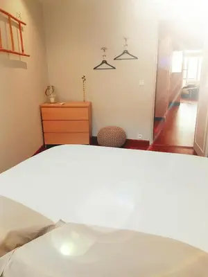 a bedroom with a bed and a dresser and a mirror at Latour Sea Cannes in Cannes