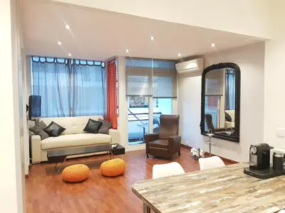 a living room with a couch and a chair at Latour Sea Cannes in Cannes