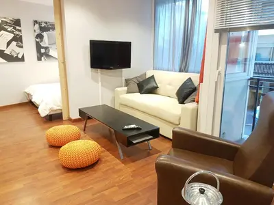 a living room with a couch and a table at Latour Sea Cannes in Cannes