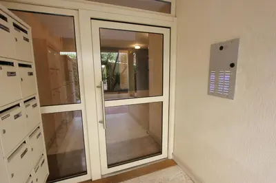 a glass door in a room with a hallway at Fauvettes Sea Cannes in Cannes