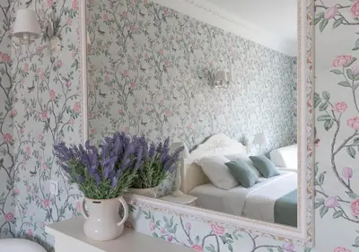 a bedroom with a bed and a mirror at Palais Miramar Imperial Croisette in Cannes