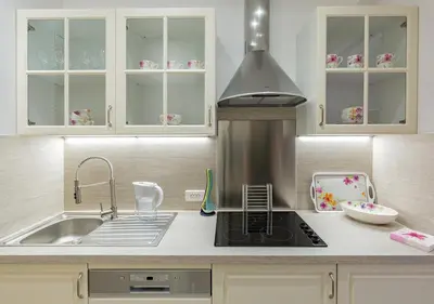 a kitchen with a sink and a stove at Palais Miramar Imperial Croisette in Cannes