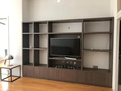 a entertainment center with a flat screen tv in a living room at Vieux port de Cannes in Cannes