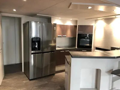 a kitchen with a stainless steel refrigerator and appliances at Vieux port de Cannes in Cannes