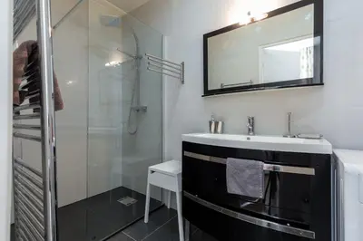 a bathroom with a sink and a shower at Le St Honoré in Cannes