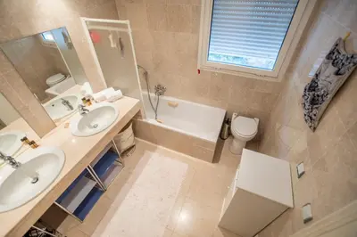 a bedroom with a bed with two stuffed animals on it at Leisure Apartment by Connexion in Cannes