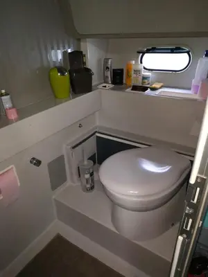 a small bathroom with a toilet in an airplane at Ferretti 36 ' Bateau à Quai Vieux-Port Cannes Festival La Croisette in Cannes