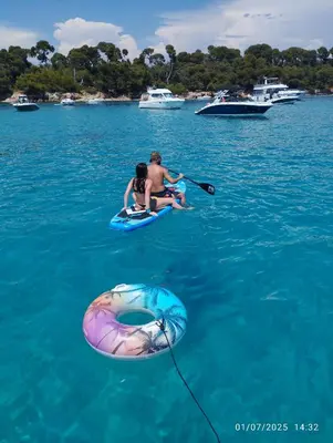 two people in the water on rafts in the water at Ferretti 36 ' Bateau à Quai Vieux-Port Cannes Festival La Croisette in Cannes