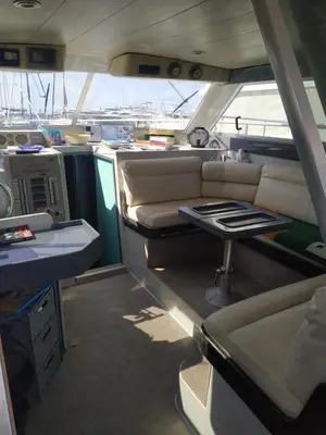 an empty interior of a boat with a table in it at Ferretti 36 ' Bateau à Quai Vieux-Port Cannes Festival La Croisette in Cannes