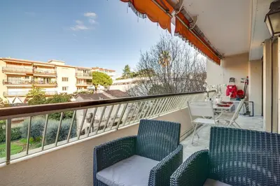 a balcony with two chairs and a table at Superb 1 bedroom appartement - close to Croisette in Cannes