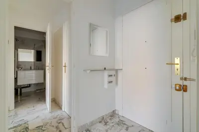 a white room with a door and a hallway at Superb 1 bedroom appartement - close to Croisette in Cannes