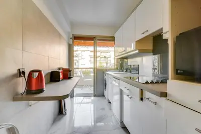 a kitchen with a counter with a red appliance on it at Superb 1 bedroom appartement - close to Croisette in Cannes