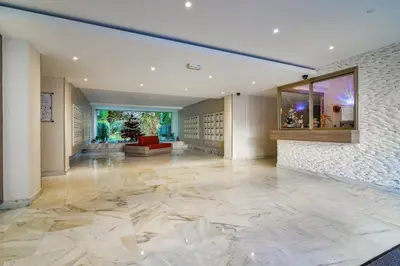 an empty lobby with a large marble floor at Superb 1 bedroom appartement - close to Croisette in Cannes