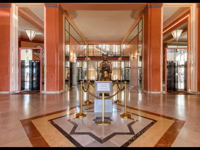 a museum with a statue in the middle of a building at Cannes Croisette Concorde Miramar in Cannes