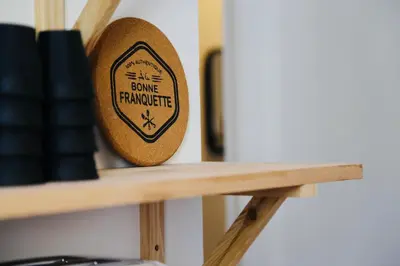 a wooden sign sitting on top of a shelf at Le Salvator in Cannes