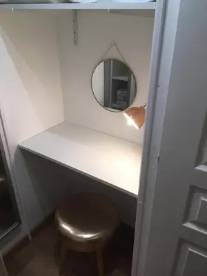 a dressing table with a stool and a mirror at 2 rooms apartment, near the sea and local market in Cannes