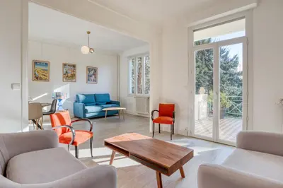 a living room with chairs and a table at IMMOGROOM - EXCLUSIVE - Terrace - Amazing quiet place - Wifi in Cannes