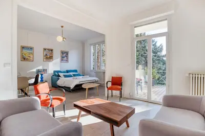 a living room with a couch and a table at IMMOGROOM - EXCLUSIVE - Terrace - Amazing quiet place - Wifi in Cannes
