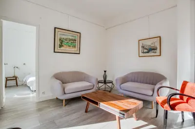 a living room with two chairs and a table at IMMOGROOM - EXCLUSIVE - Terrace - Amazing quiet place - Wifi in Cannes