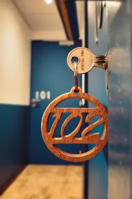 a lock on a door with a logo on it at Charlie's Hôtel Cannes in Cannes