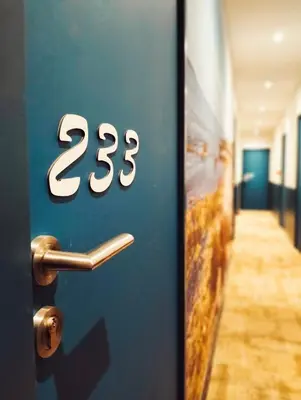 a door with the number twenty three on it at Charlie's Hôtel Cannes in Cannes