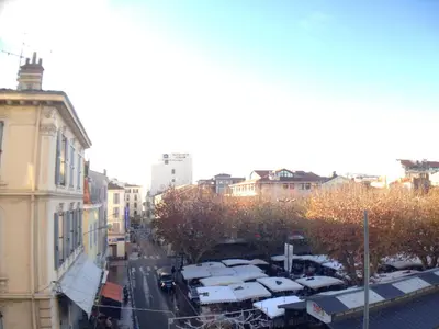 a view of a city street with trees and buildings at CANNES Festival Films Center, with 2 bedrooms and balcony in Cannes