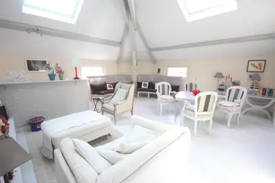 a living room with white couches and chairs at carré d'or rue d'ANTIBES à quelques pas du palais des Festivals in Cannes