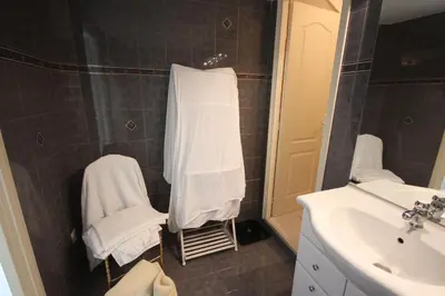 a bathroom with a sink and a white towel at carré d'or rue d'ANTIBES à quelques pas du palais des Festivals in Cannes