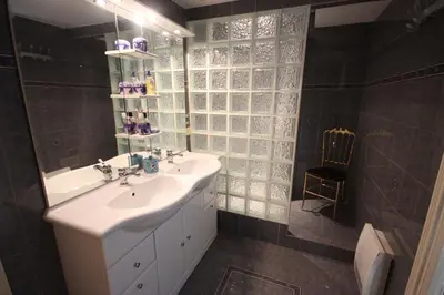 a bathroom with a sink and a mirror at carré d'or rue d'ANTIBES à quelques pas du palais des Festivals in Cannes