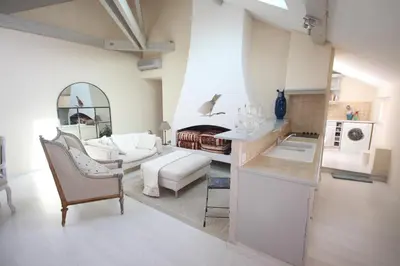 a living room with a couch and a table at carré d'or rue d'ANTIBES à quelques pas du palais des Festivals in Cannes