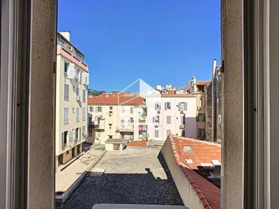 a view from a window of a city with buildings at Studio Vagliano in Cannes