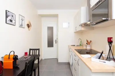 a kitchen with a sink and a counter top at 2-Br Apartment 2 min from the Beaches in Cannes
