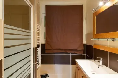 a bathroom with a sink and a shower at 2-Br Apartment 2 min from the Beaches in Cannes