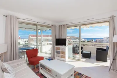 a living room with a view of a living room at High-Standard 2-Bedroom Apartment with Sea View and Large Terrace in Cannes